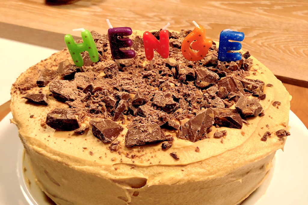 Salted Caramel Cake with candles that say HENGE