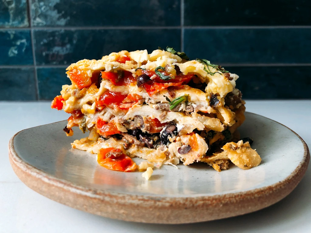 Plate with a slice of mexican lasagne