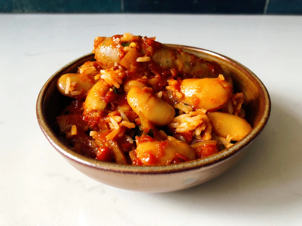 Gold bowl with Sausage and White Bean Casserole