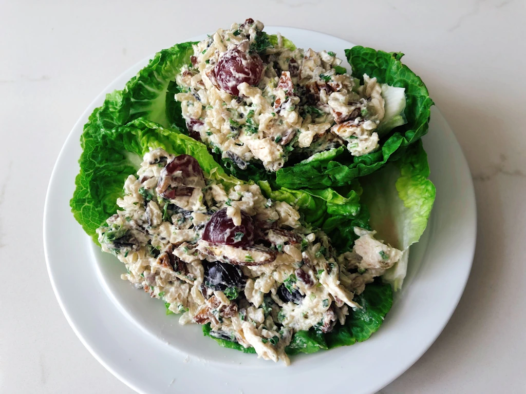 Plate with lettuce cups filled with wild rice chicken salad