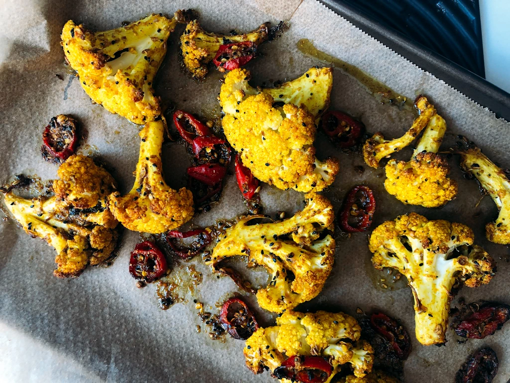 Recipe for indian spiced cauliflower arranged on a tray