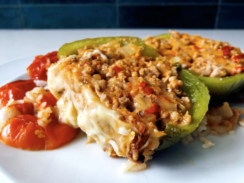 Recipe for pork and gruyere stuffed peppers with roasted tomatoes